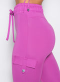 close up left side profile shot of a model wearing the Cargo Edge Leggings in hyper violet color