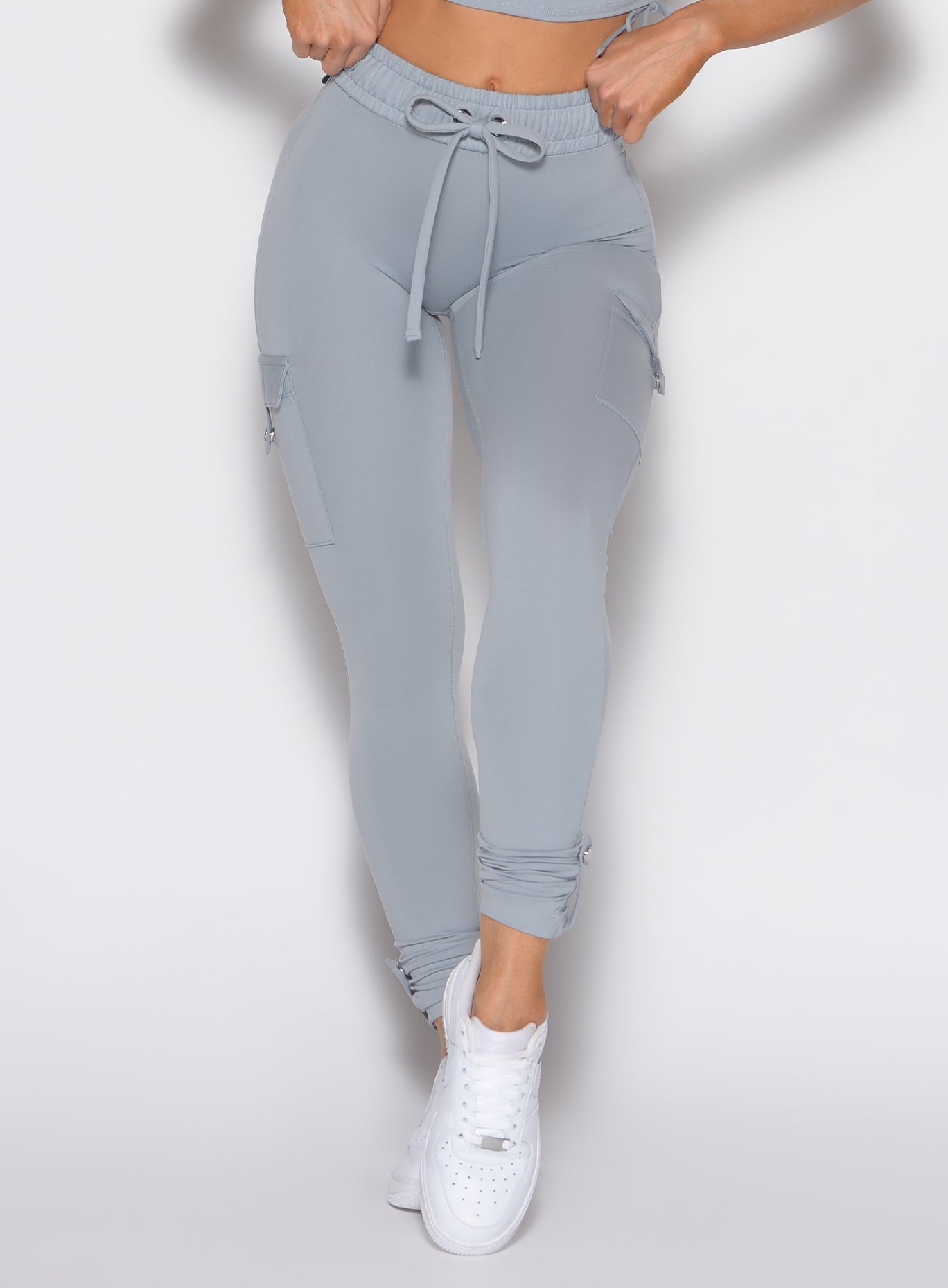 Quarry Cargo Edge Leggings featuring utility snap pockets and a high-waist, sculpting gym fit.