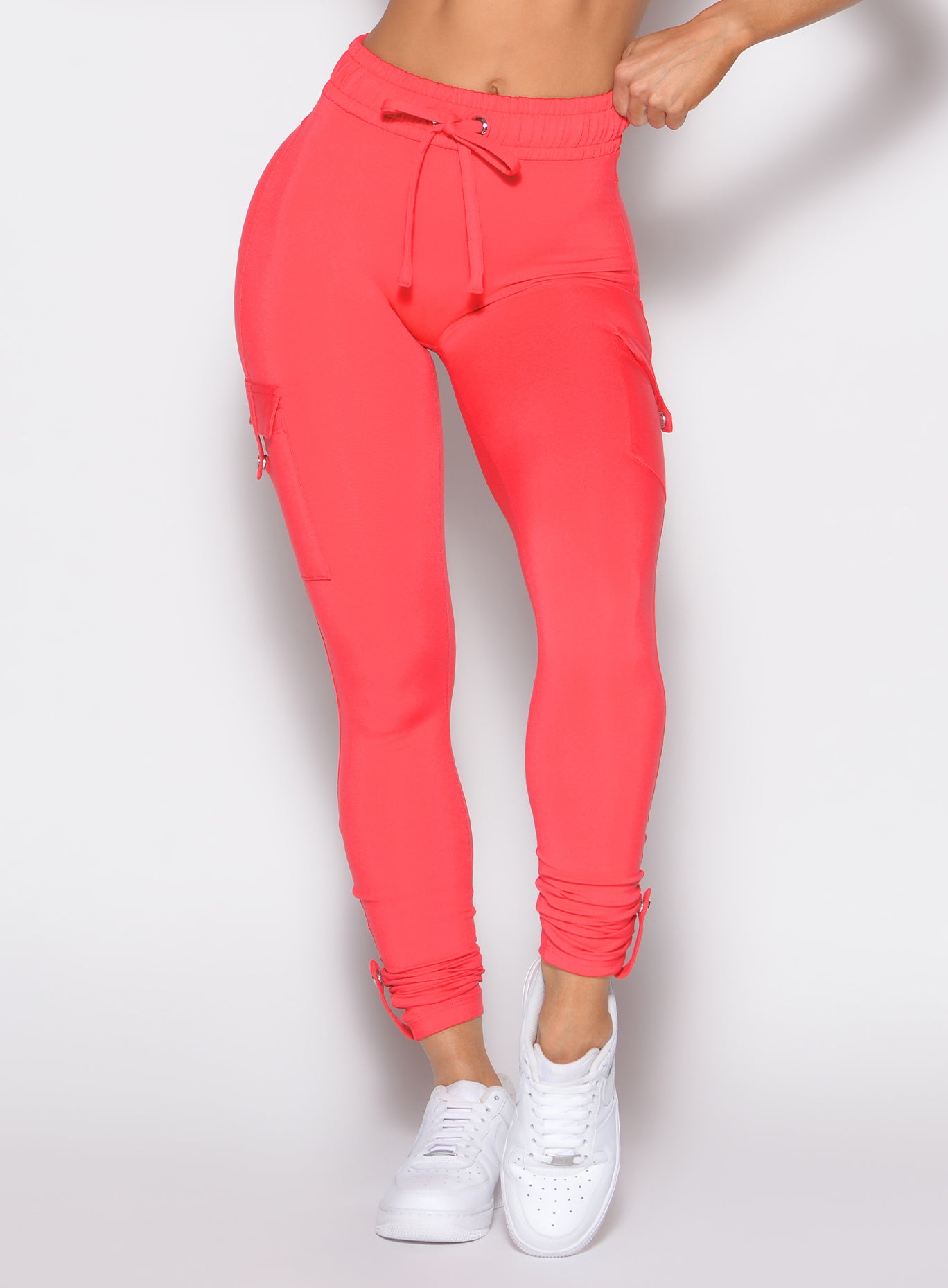 Raspberry Blush Cargo Edge Leggings featuring a cinched high-waist and utility snap side pockets.