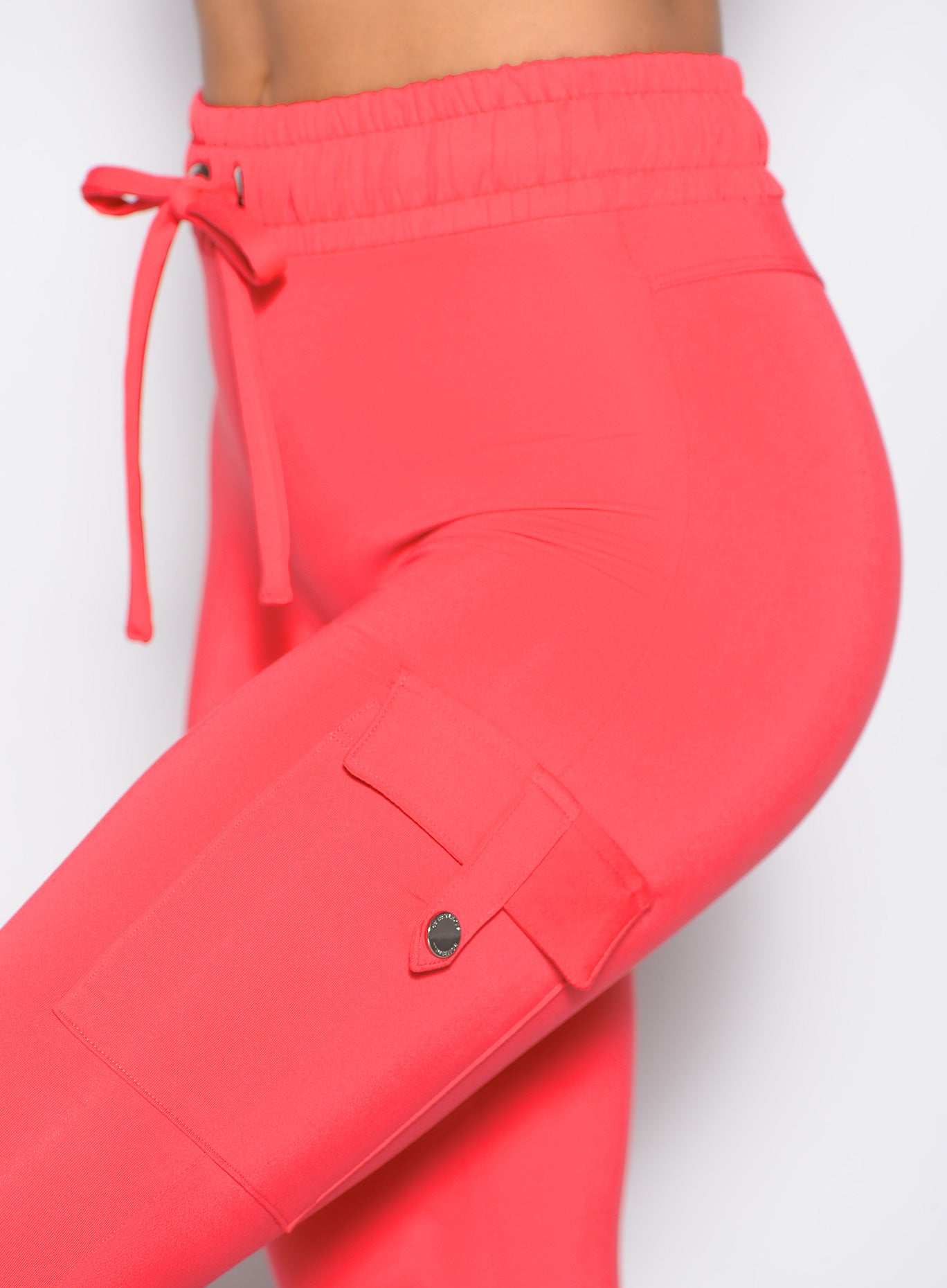 Raspberry Blush Cargo Edge Leggings featuring side snap pockets and a custom cinchable waist tie.