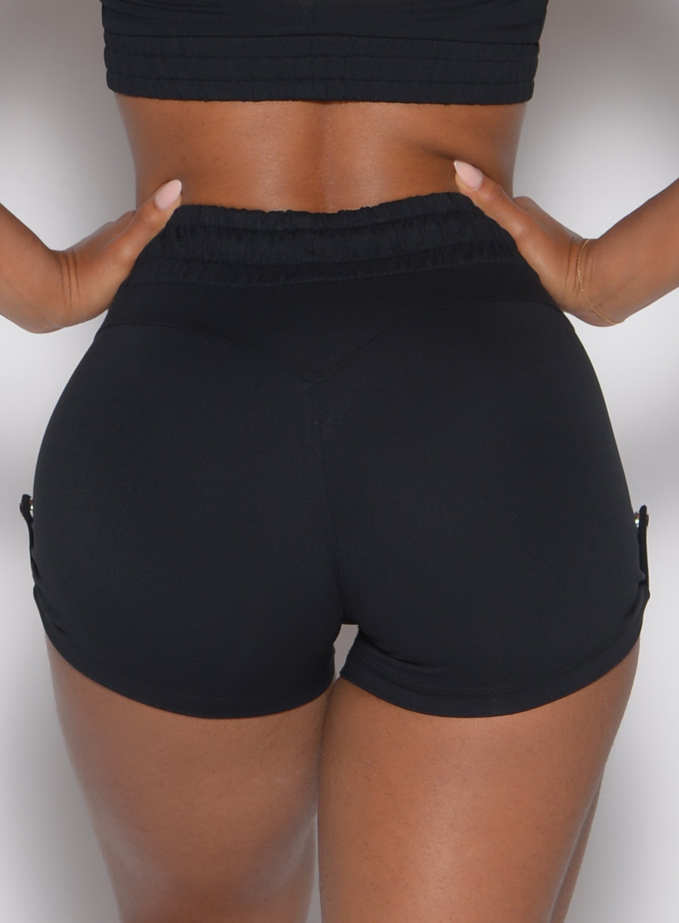 Black Cargo Edge Shorts featuring a sweetheart butt seam and internal scrunch for a sculpted fit.