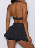 close up back profile view of a model wearing the Champion Skort in Charcoal color 