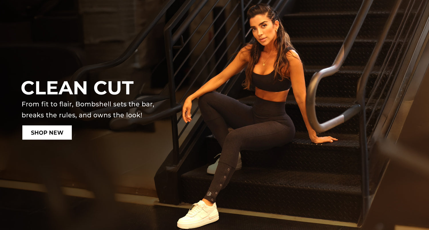 A fit model sitting on stairs wearing a black sports bra with matching leggings. Text overlay reads: 'CLEAN CUT From fit to flair, Bombshell sets the bar, breaks the rules, and owns the look' CTA button reads 'SHOP NOW'
