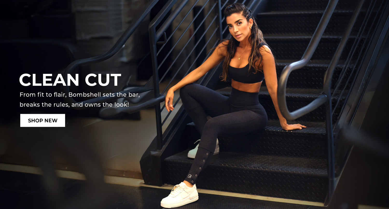 A fit model sitting on stairs wearing a black sports bra with matching leggings. Text overlay reads: 'CLEAN CUT From fit to flair, Bombshell sets the bar, breaks the rules, and owns the look' CTA button reads 'SHOP NOW'
