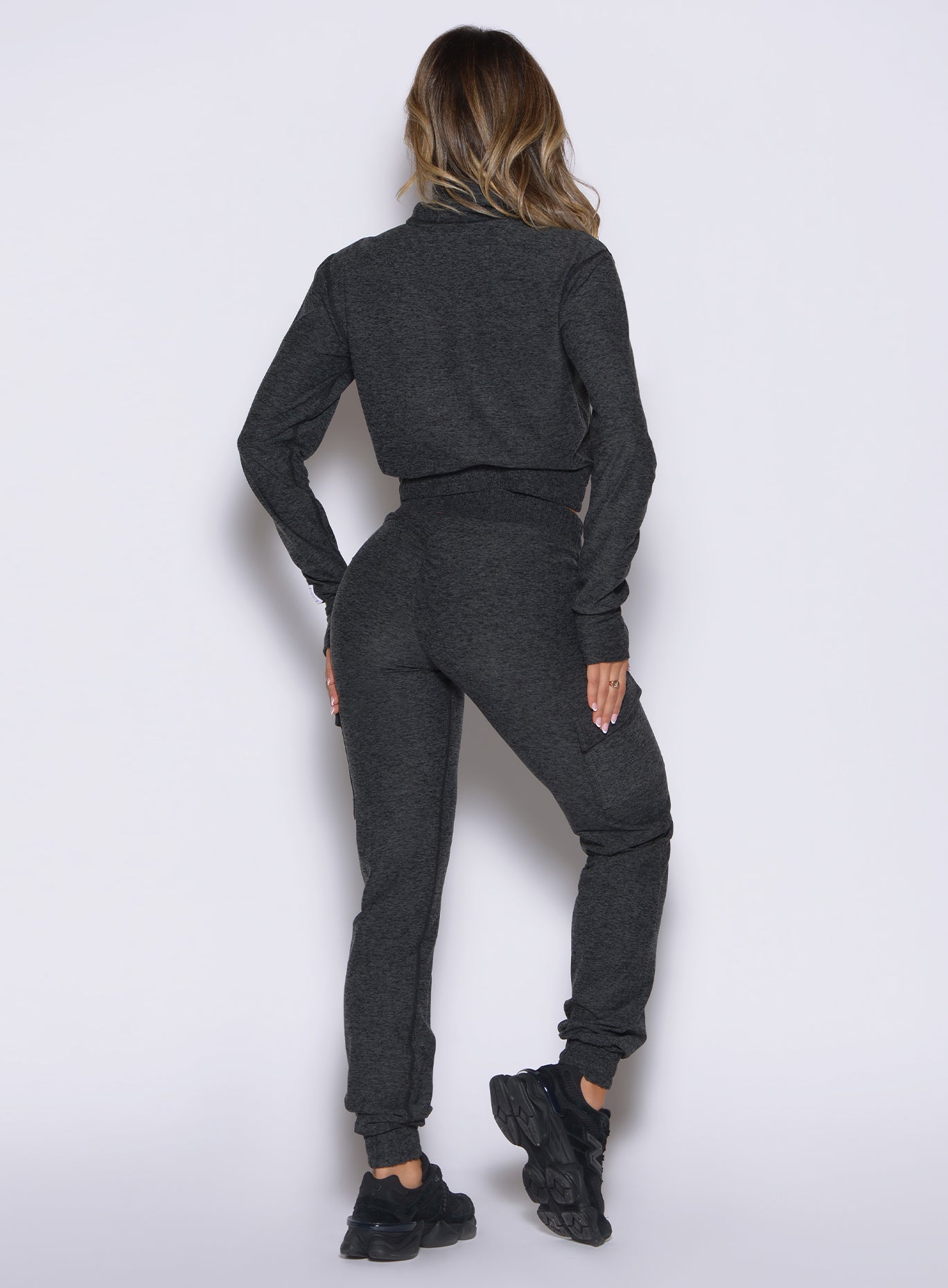 back profile view of a model wearing the Cloud Comfort Joggers in charcoal color
