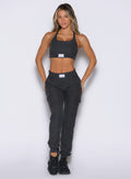 front profile view of a model with both hands on her thighs wearing the Cloud Comfort Joggers in charcoal color