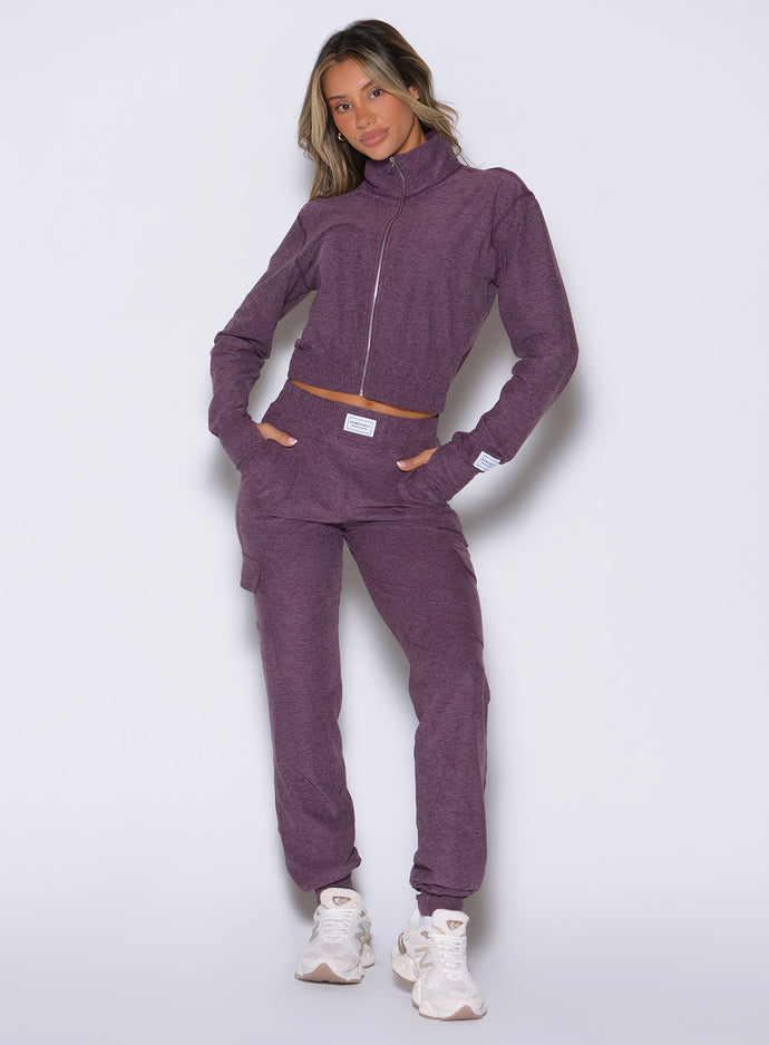 front profile view of a model with both hands inside the side pockets wearing the Cloud Comfort Joggers in regal purple color