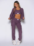 front profile view of a model wearing the Cloud Comfort Joggers in regal purple color