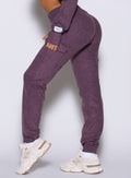 close up left side view of a model wearing the Cloud Comfort Joggers in regal purple color