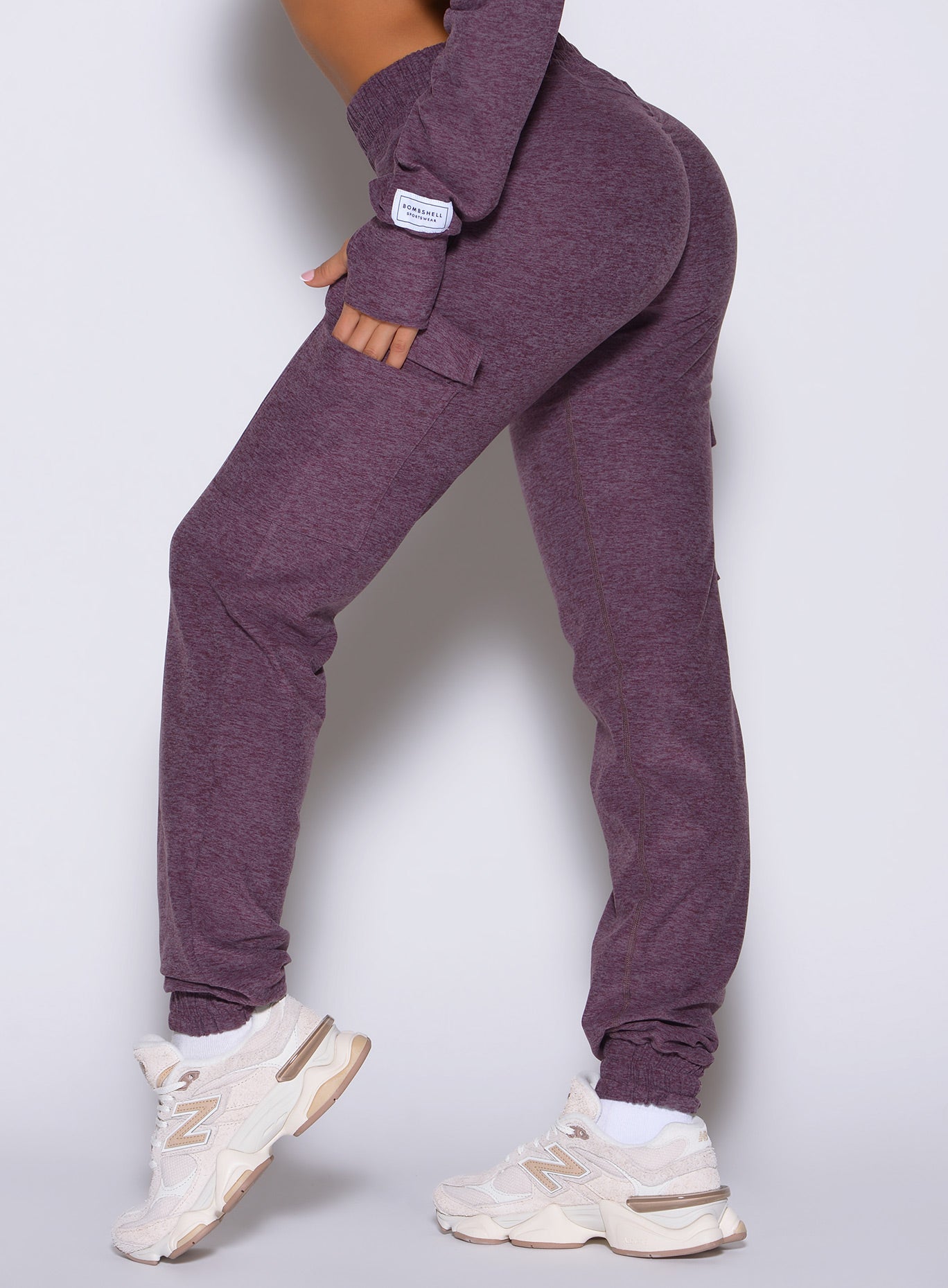 close up left side view of a model wearing the Cloud Comfort Joggers in regal purple color