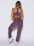 back profile view of a model wearing the Cloud Comfort Joggers in regal purple color