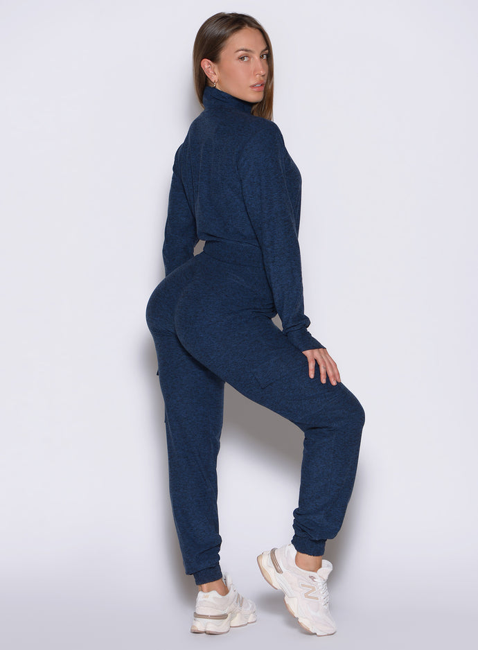right side profile view of a model looking over her shoulder wearing the Cloud Comfort Joggers in Sapphire Blue color