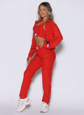 front left side profile view of a model wearing the Cloud Comfort Joggers in scarlet red color