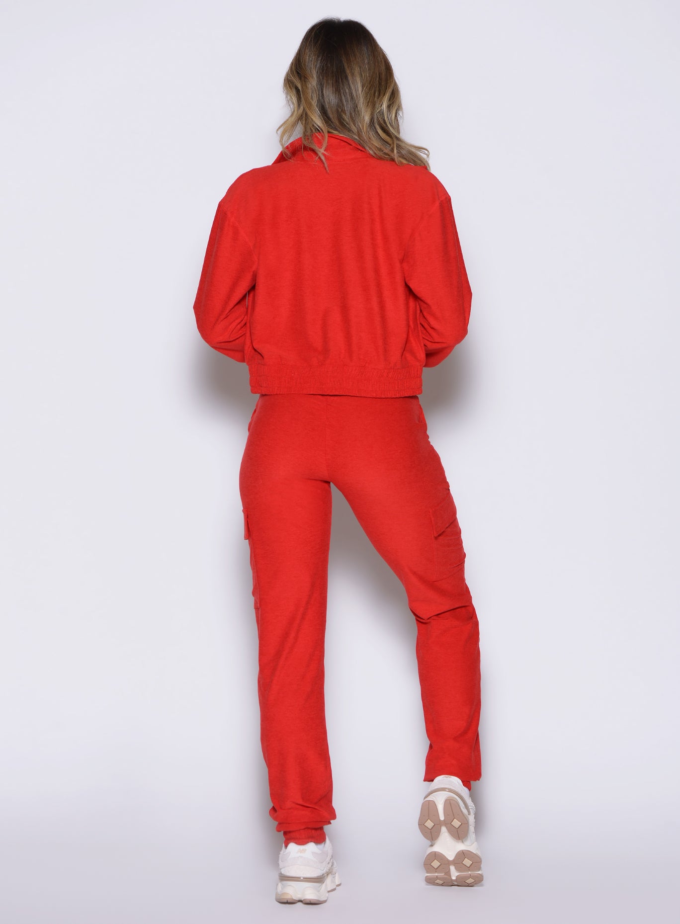 back profile view of a model wearing the Cloud Comfort Joggers in scarlet red color