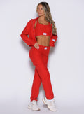 front profile view of a model looking to the right side wearing the Cloud Comfort Joggers in scarlet red color
