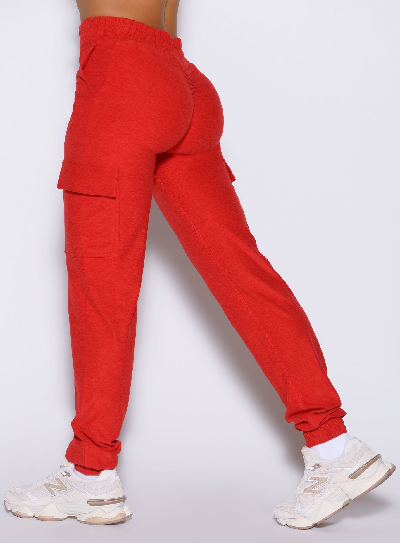 close up left side view of a model wearing the Cloud Comfort Joggers in scarlet red color