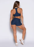 back side view of a model facing to the right side wearing the Cloud Comfort Shorts in Sapphire Blue color