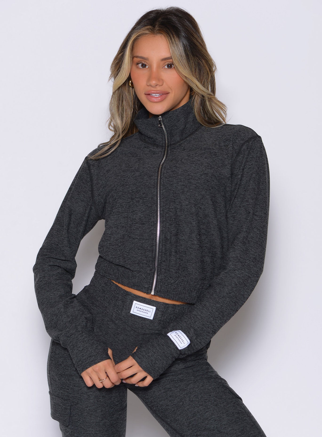 front profile view of a model wearing the Cloud Full Length Jacket in Charcoal color