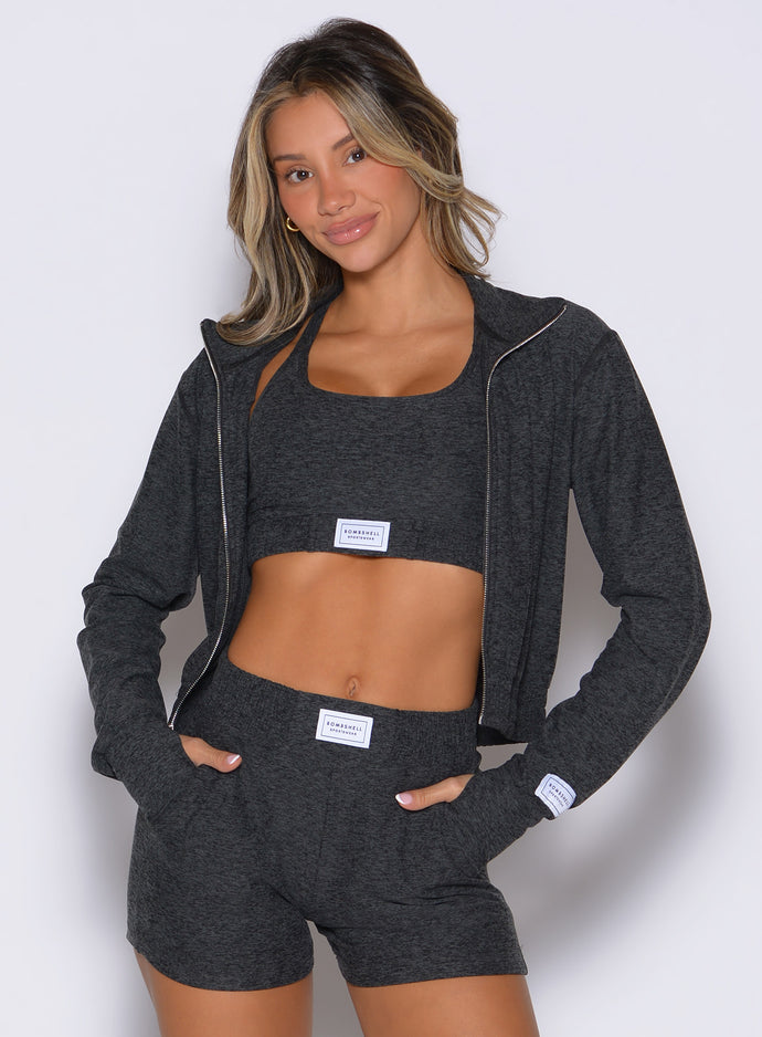 front profile view of a model wearing the Cloud Full Length Jacket in Charcoal color paired with the matching shorts 