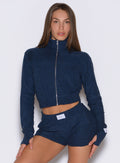 frontal shot of a model wearing the Cloud Full Length Jacket in Sapphire Blue color