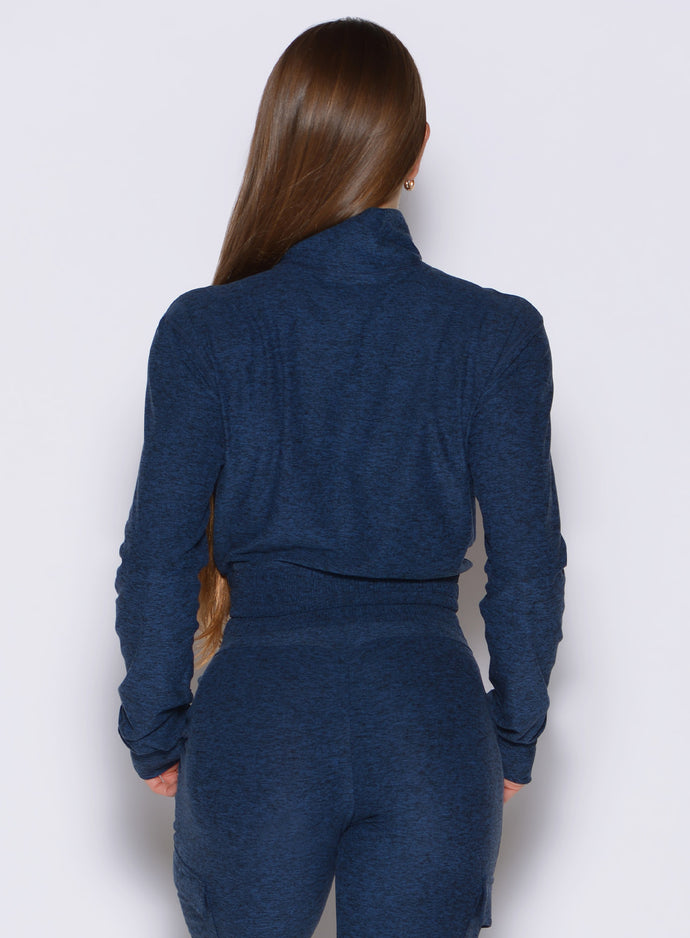 back profile view of a model wearing the Cloud Full Length Jacket in Sapphire Blue color