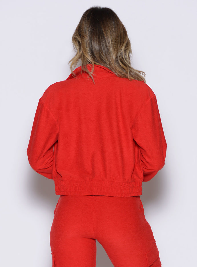 back profile view of a model wearing the Cloud Full Length Jacket in scarlet red color