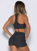 back profile view of a model wearing the Cloud Lounge Bra in Charcoal color paired with the matching shorts 