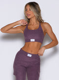 front profile view of a model looking to the right side wearing the Cloud Lounge Bra in regal purple color
