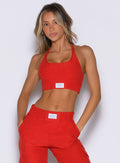 front profile view of a model wearing the Cloud Lounge Bra in scarlet red color