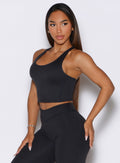Heathered Black Core Comfort Tank in a side profile view, paired with matching sculpting leggings.