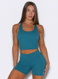 Front profile view of the model wearing our Core Comfort Tank in Seafoam color, paired with matching shorts.