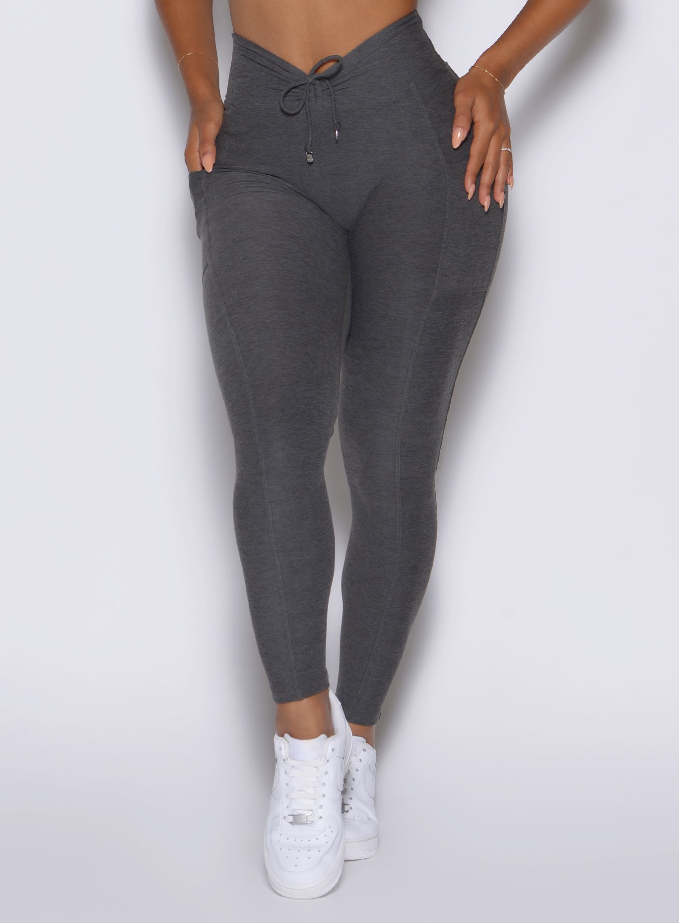 close up front view of a model wearing the Charm Fit Leggings in Steel Shadow color