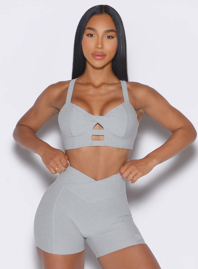 front view of a model wearing our core set bra in cloud color along with the matching shorts