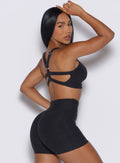right profile view of a model wearing our core set bra in heather black color along with the matching shorts