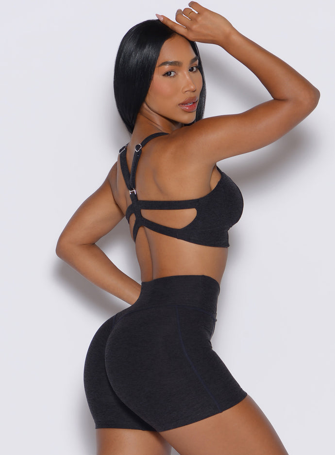 right profile view of a model wearing our core set bra in heather black color along with the matching shorts