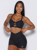 front view of a model wearing our core set bra in heather black color along with the matching shorts