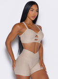 side right profile view of a model wearing our core set bra in taupe color along with the matching shorts