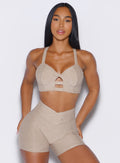front profile view of a model wearing our core set bra in taupe color along with the matching shorts