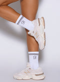 left side shot of a model wearing the Crew Socks in cloud color