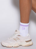 Side profile of violet Crew Socks featuring a breathable ribbed design and performance fit.