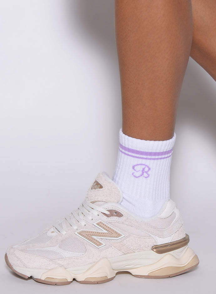 Side profile of violet Crew Socks featuring a breathable ribbed design and performance fit.