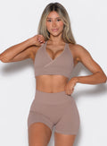 front profile view of a model wearing our cross over bra in soft mocha color along with the matching shorts