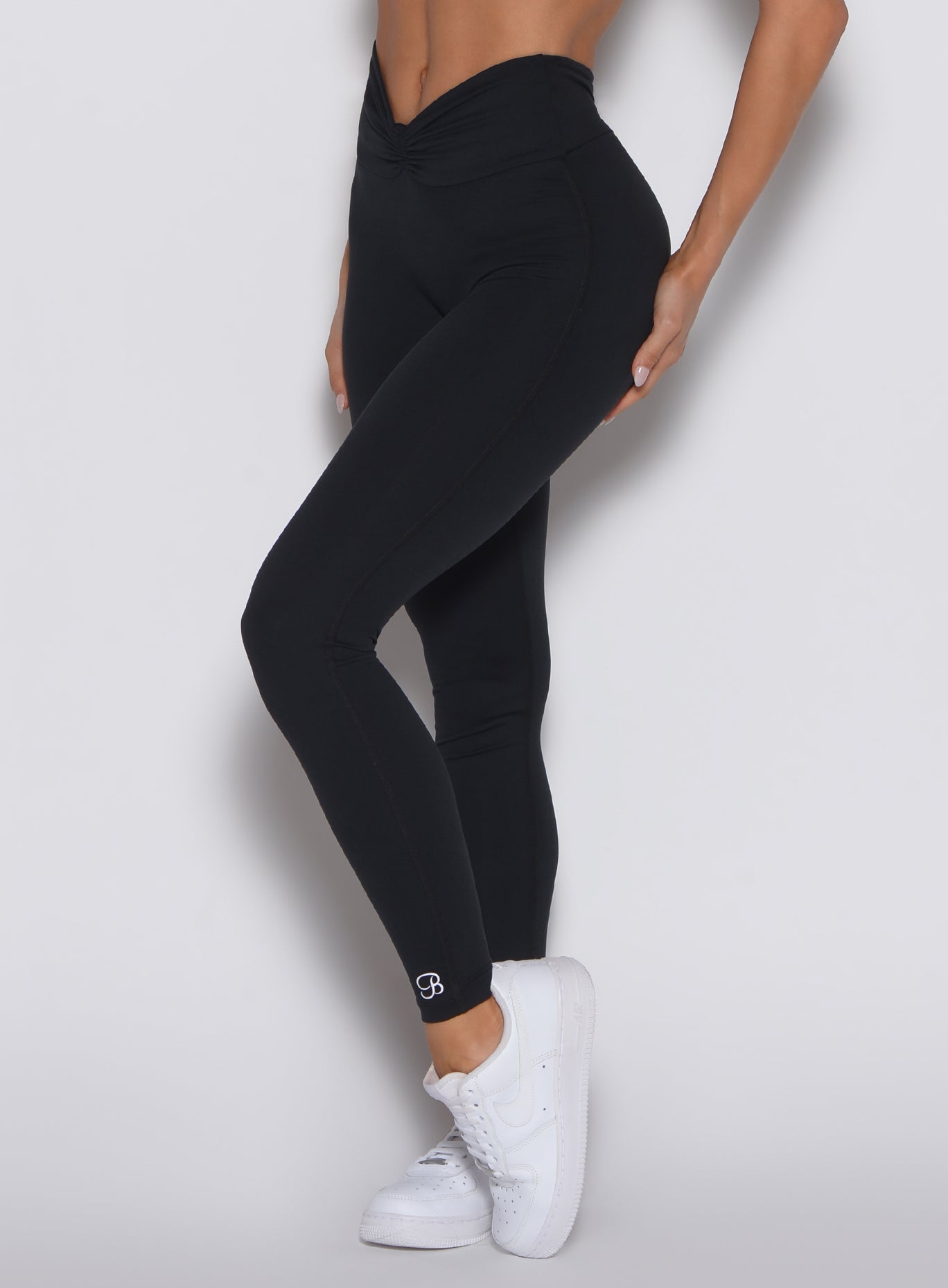 Black high-waisted Curvemax Leggings with adjustable tie waistband for a custom sculpting gym fit.
