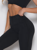 close up left side view of a model wearing the Curvemax Leggings in Black color