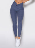 front profile view of a model wearing the Curvemax leggings in wisteria blue color