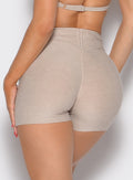 close up back profile view of a model wearing the Curvemax Shorts in taupe color
