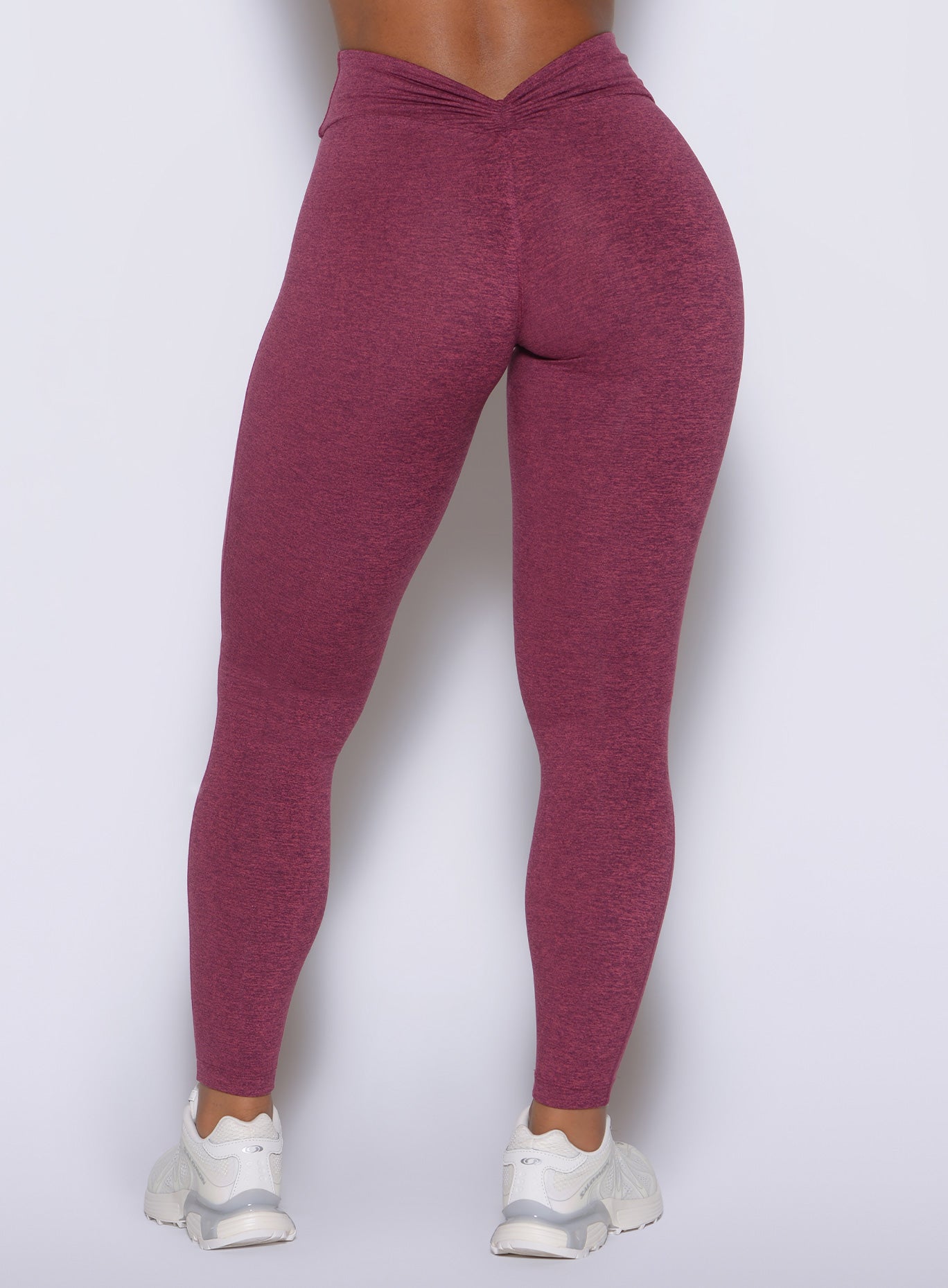 A deep V cut back waistband highlights a sculpted, glute enhancing rear profile.