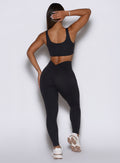 Curve-enhancing black gym leggings with V-cut waistband and flattering scrunch back detail.