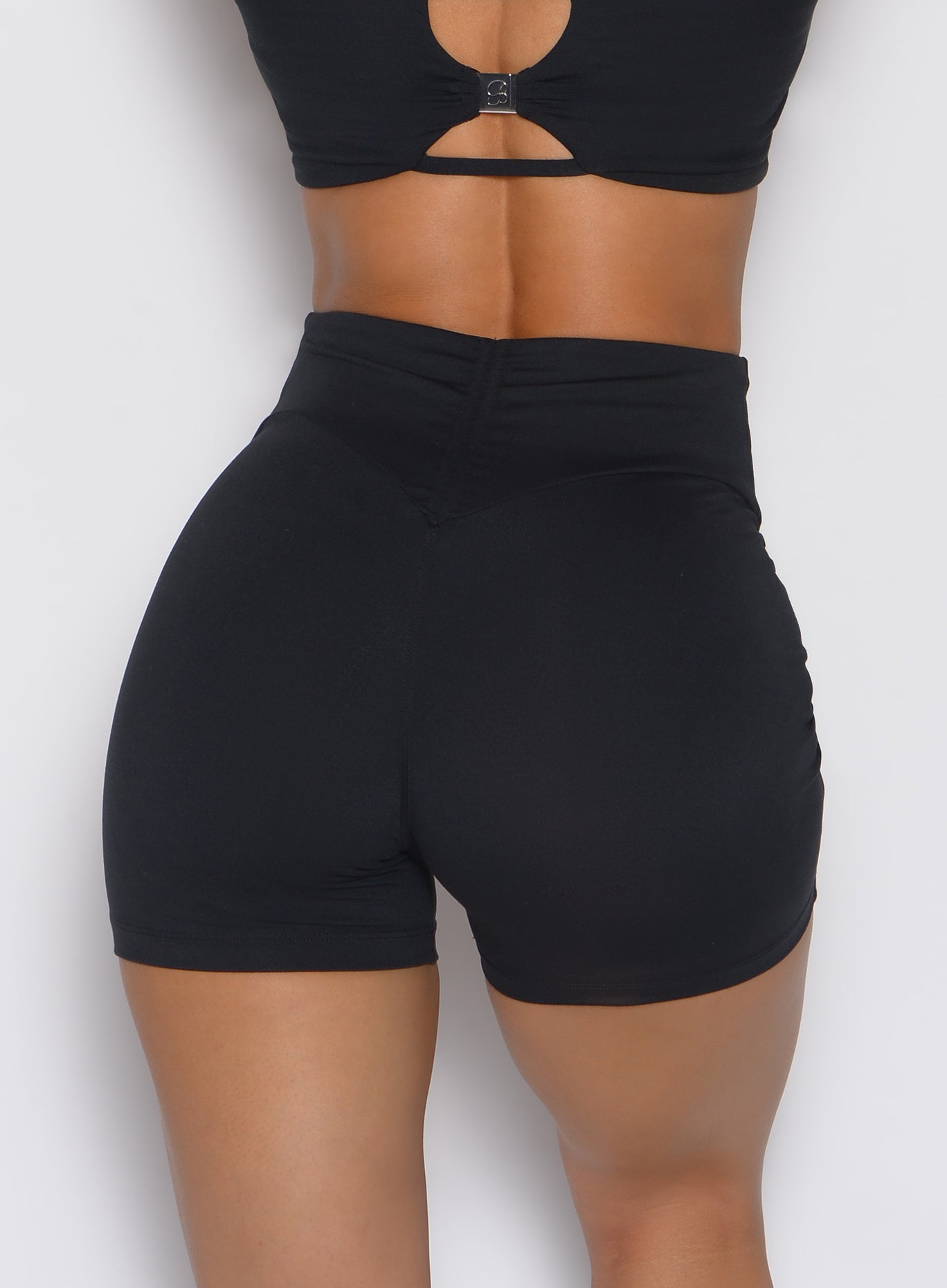 Black Curvemax Shorts feature an internal scrunch butt and adjustable ties for a sculpted gym fit.