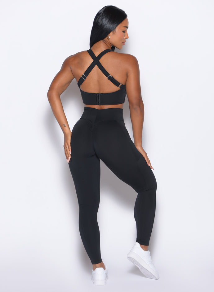 Back profile view of our model wearing the Curves Leggings in Black color